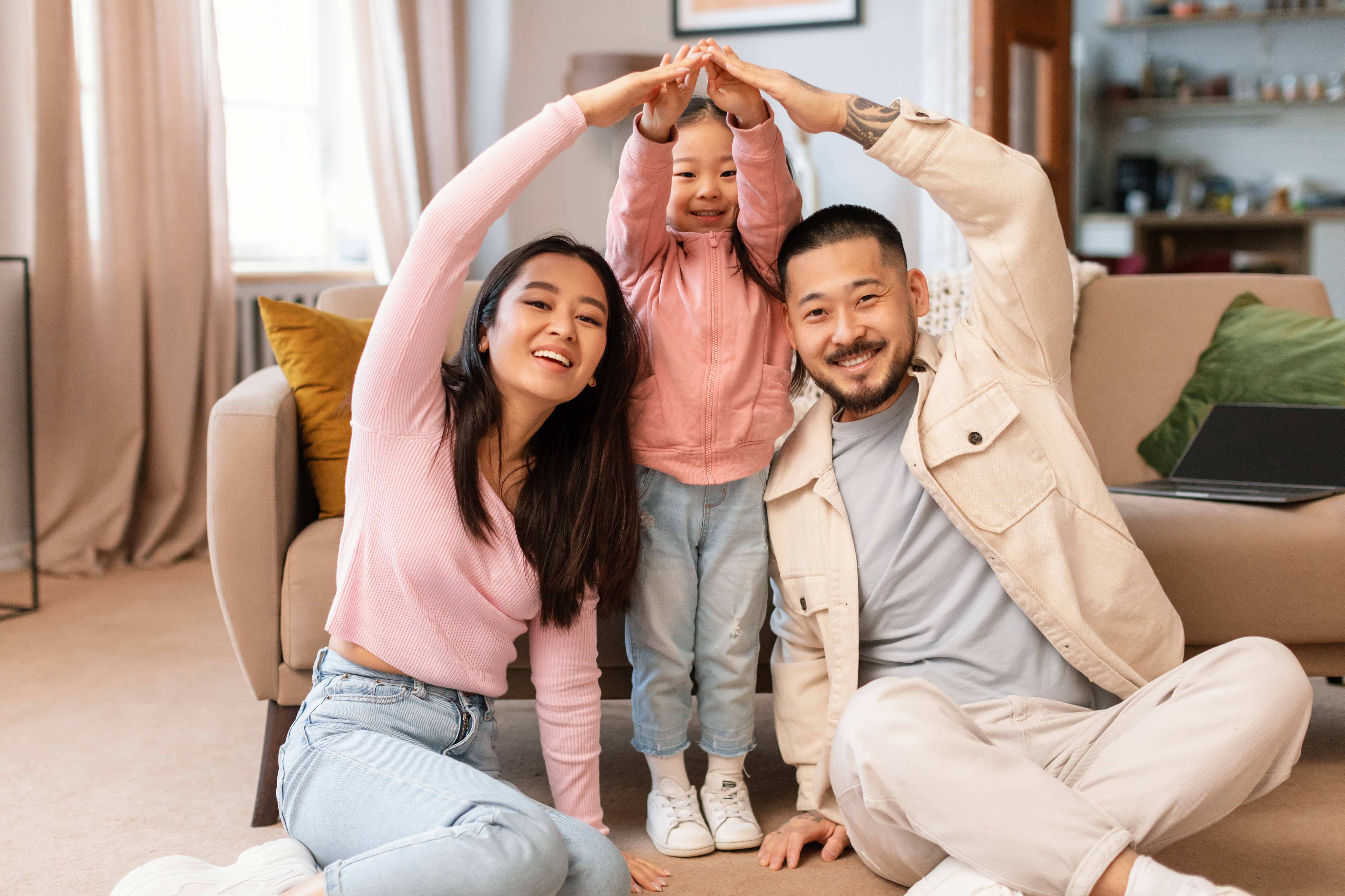 asian family with child celebrating homeownership 2023 05 12 21 05 26 utc min