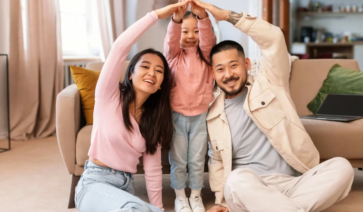 asian-family-with-child-celebrating-homeownership-2023-05-12-21-05-26-utc-min